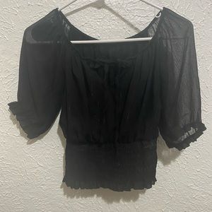 black ruffled sleeve shirt.